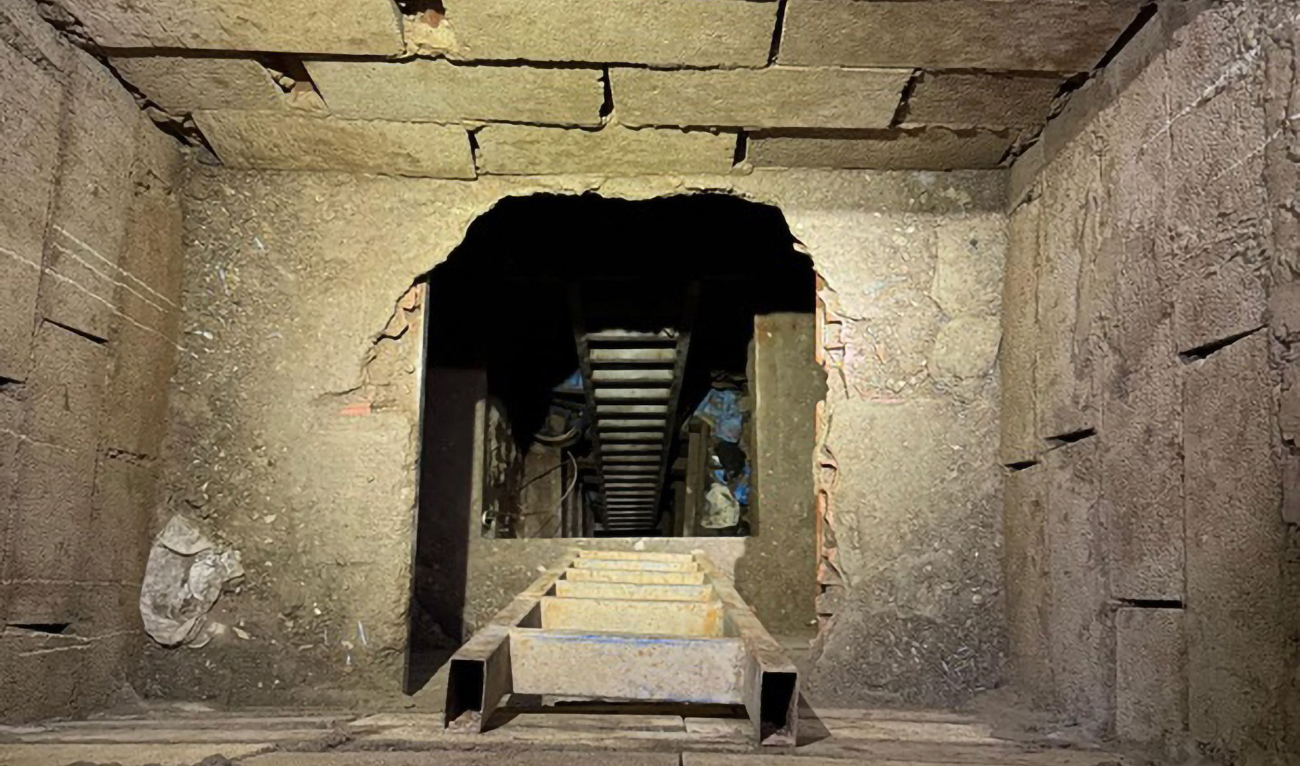 This handout photo released by Spanish Guardia Civil on February 19, 2025, shows the entrance of a 50 meters long tunnel, found in Spain's African enclave of Ceuta, which might have been used to transport drugs from Morocco to Spain. (AFP)