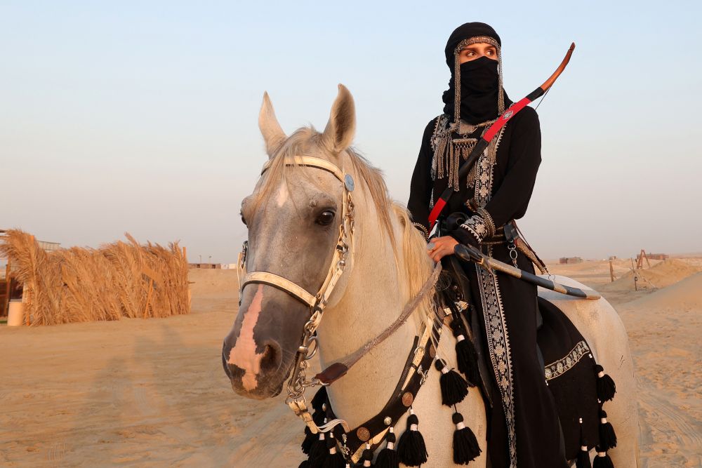 Saudi equestrian Noura Al-Jabr wears a traditional outfit, Dammam, Saudi Arabia, Aug. 14, 2023. (AFP)
