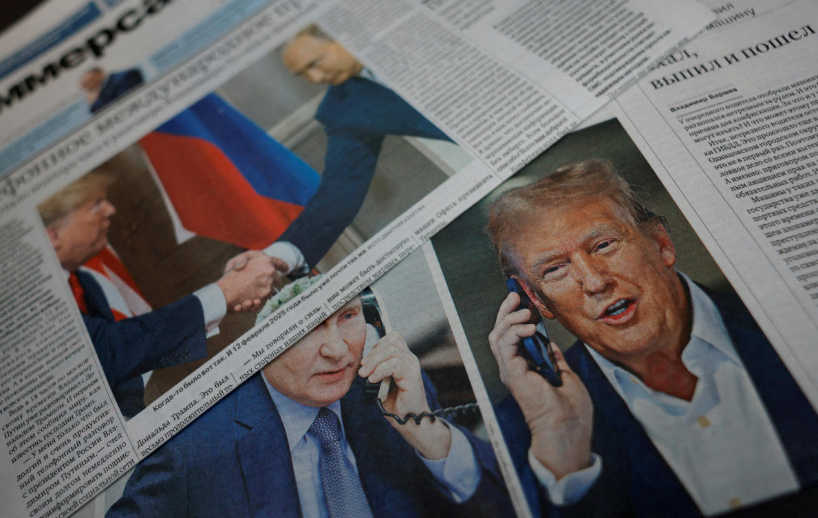 Above, newspapers with covers, dedicated to the recent phone call of Russian President Vladimir Putin and US President Donald Trump, in a street in Moscow on Feb.13, 2025. (Reuters)