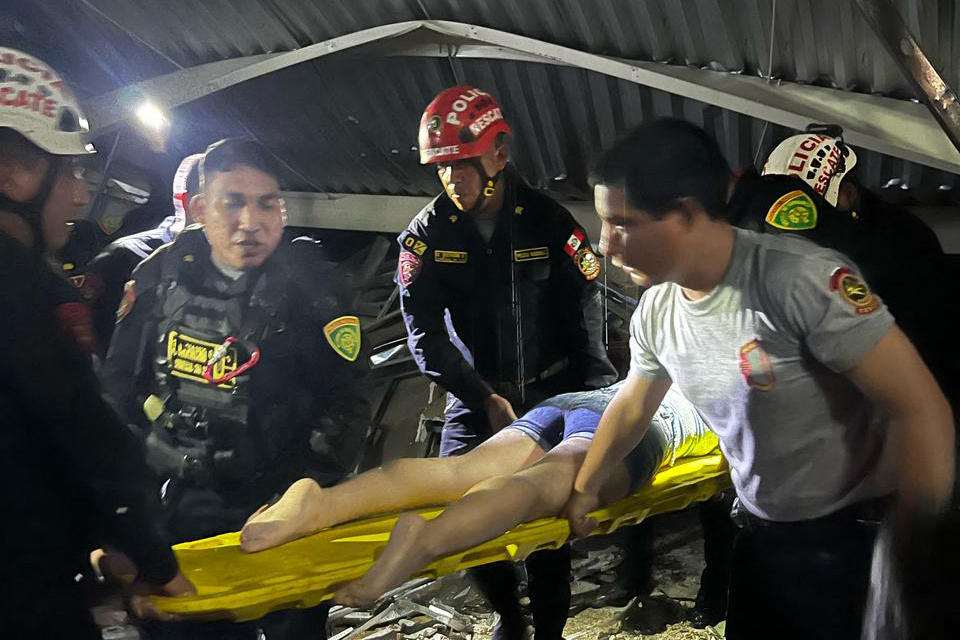 Rescue teams work at the scene of an accident in which a roof of a food court collapsed in a shopping mall in Trujillo, Peru on Febr. 21, 2025(La Libertad Police Region/AFP)