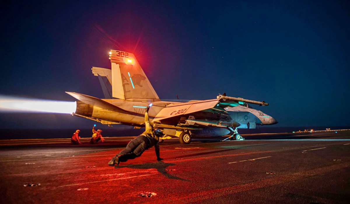 In this on February 24, 2024, image released by the US Central Command, a US fighter plane lauches from the deck of the aircraft carrier USS Eisenhower in the Red Sea during operations against Huthi targets. (AFP)