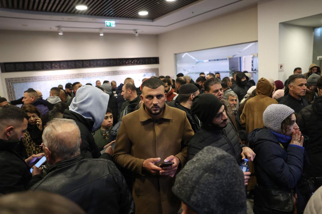 Palestinian families react after Israel delayed the release of Palestinian prisoners in the occupied West Bank city of Ramallah early on Feb. 23, 2025. (AFP)