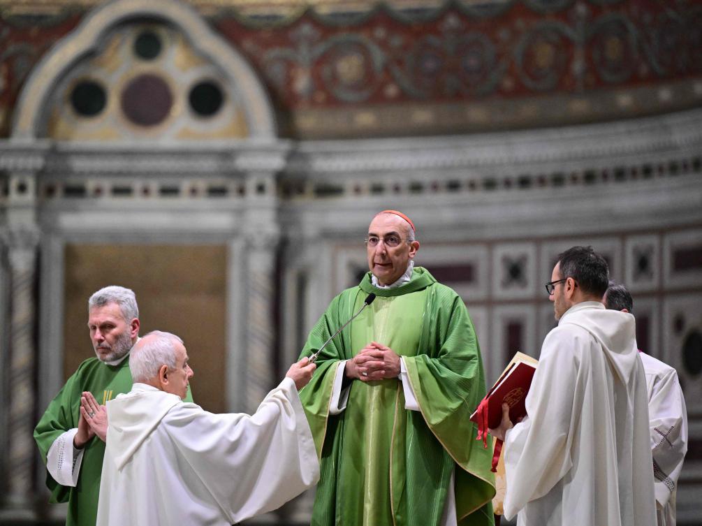 Cardinal Baldassare Reina leads a holy mass and prayers for the healing of Pope Francis at Saint John Lateran archbasilica in Rome, on February 23, 2025. (AFP)