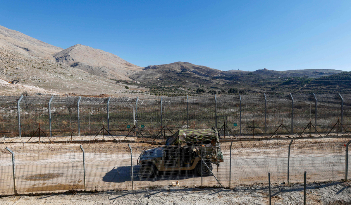 An Israeli army jeep drives in the buffer zone, which separates Israeli and Syrian forces on the Golan Heights, near the Druze village of Majdal Shams in the Israel-annexed Golan Heights on December 14, 2024. (AFP)