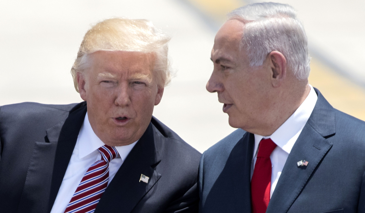 In this file photo taken on May 22, 2017, Israeli Prime Minister Benjamin Netanyahu (R) and US President Donald Trump speak upon the latter's arrival at Ben Gurion International Airport in Tel Aviv. (AFP)