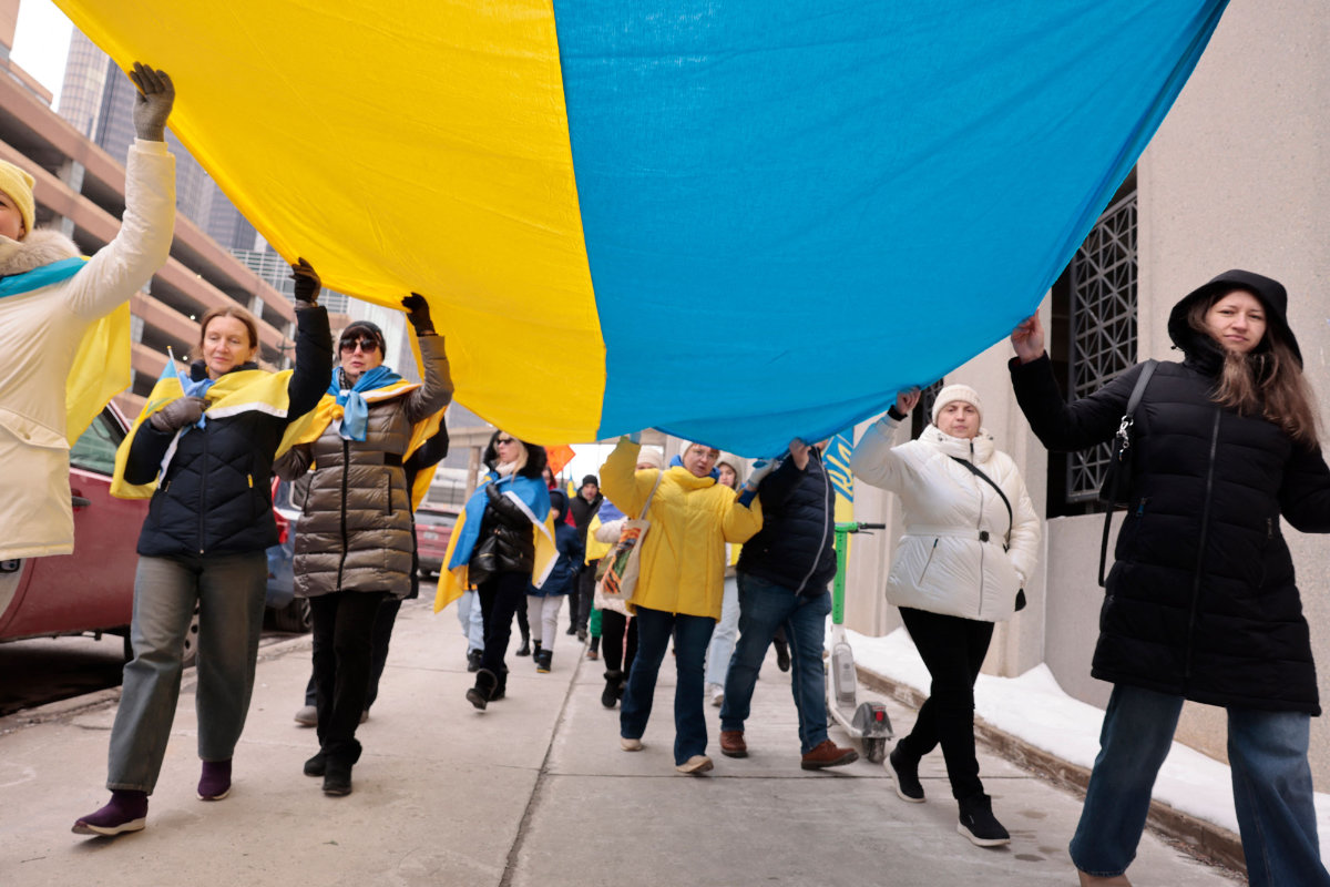 People rally in the US city of Detroit on February 23, 2025, in support of Ukraine ahead of the third anniversary of the war with Russia. (AFP)