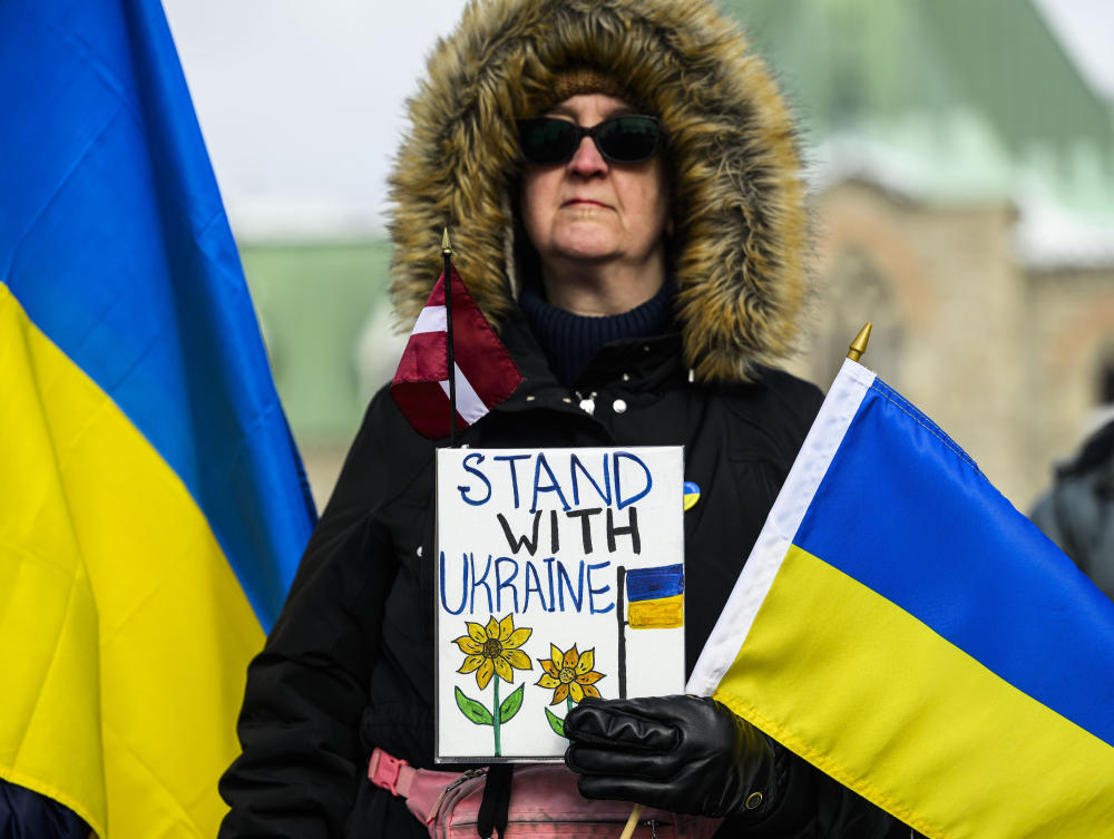 Above, a protester marks the third anniversary of Russia’s invasion of Ukraine in Ottawa on Feb. 23, 2025. (The Canadian Press via AP)