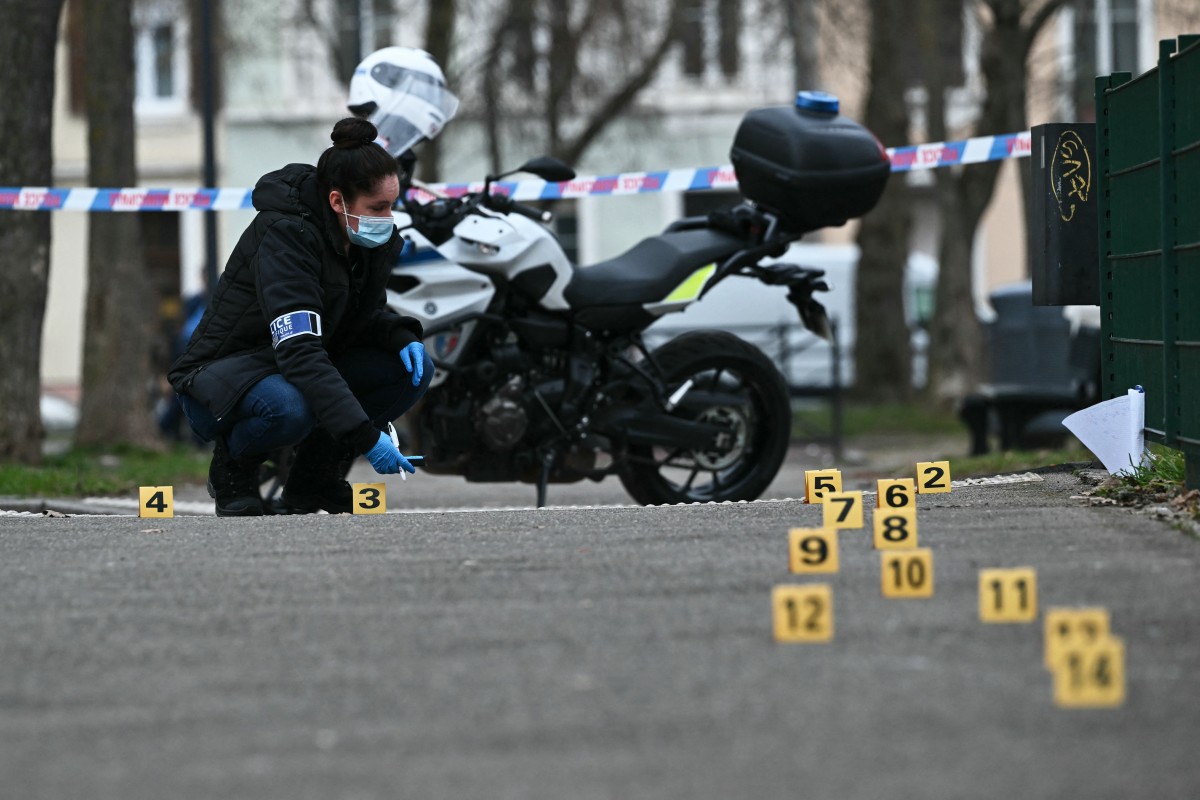 A police investigator of the French forensic police works to collect evidence at a site in Mulhouse, eastern France on February 22, 2025. (AFP)