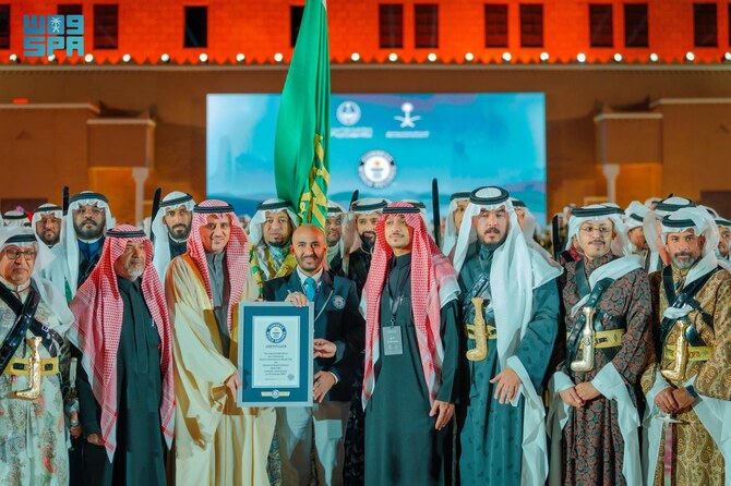 The handout photograph released on February 24, 2025, shows Saudi Ardah performers receives Guinness World Record certificate at the Founding Day celebrations in Riyadh, Saudi Arabia. (SPA)