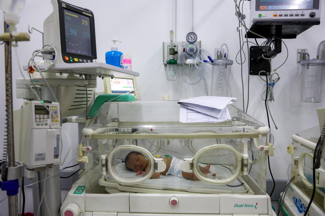 A prematurely-born infant lies in an incubator at the neonatal intensive care unit NICU at a hospital in Gaza City on February 25, 2025. (AFP)