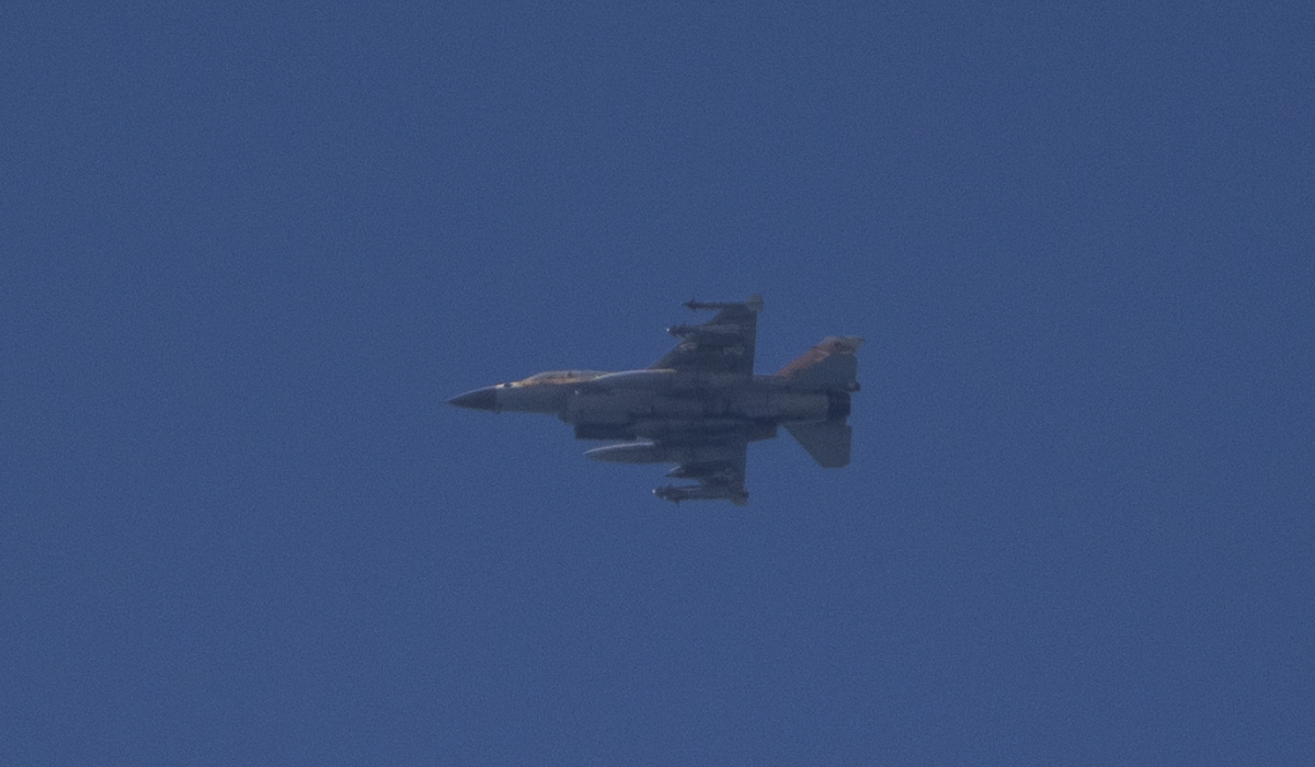 An Israeli fighter jet is seen from Hadera over the Mediterranean sea as it flies towards northern Israel, on Monday, Sept. 23, 2024. (AP)