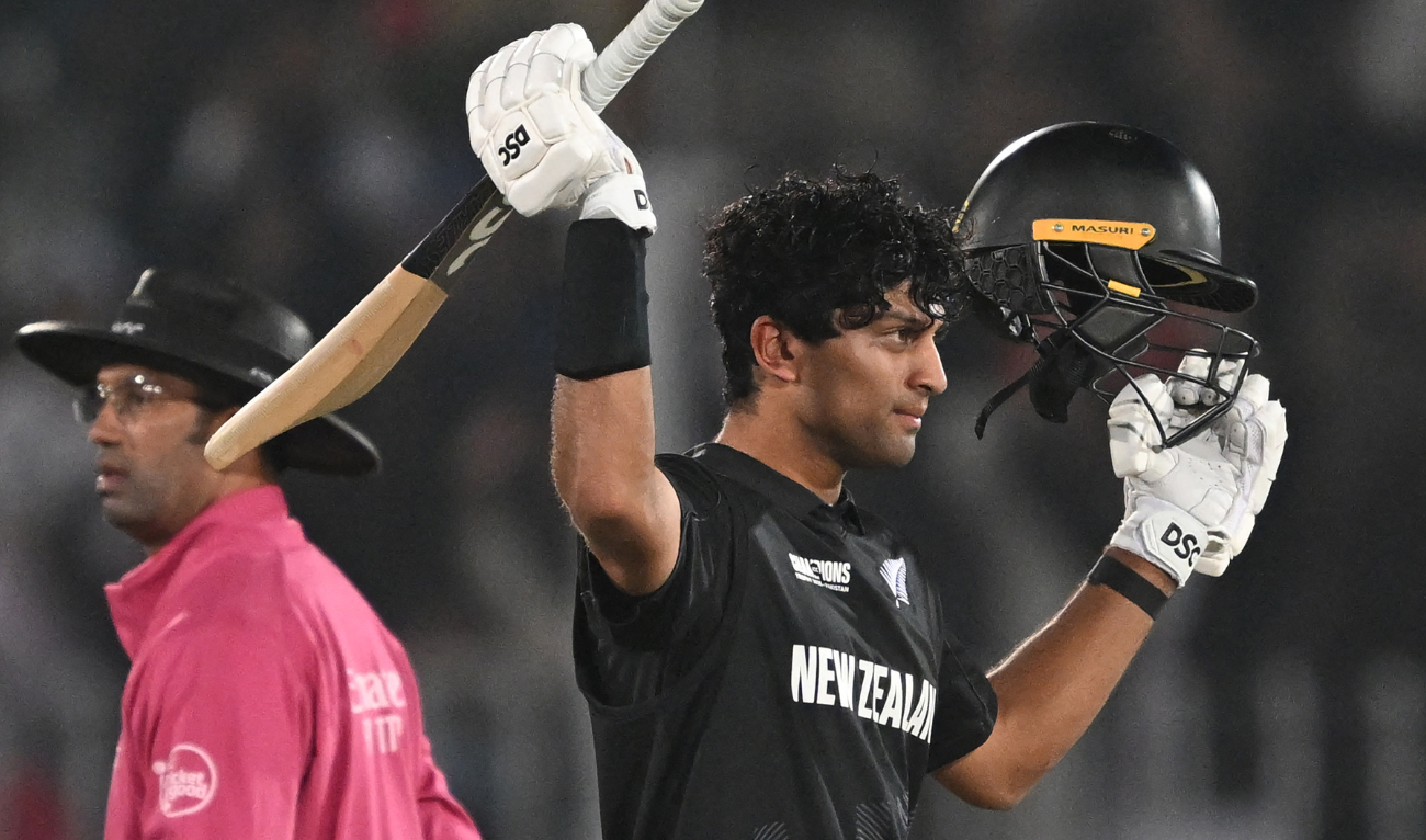 New Zealand’s Rachin Ravindra (R) celebrates after scoring a century (100 runs) during the ICC Champions Trophy one-day international (ODI) cricket match between Bangladesh and New Zealand at the Rawalpindi Cricket Stadium in Rawalpindi on February 24, 2025. (AFP)