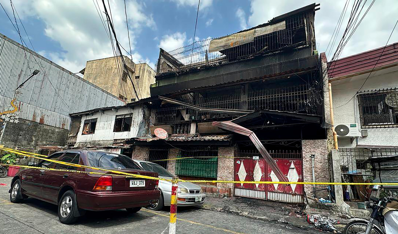 A building damaged by a fire stands in San Isidro Galas village in suburban Quezon city, Philippines, on Thursday. (AP)