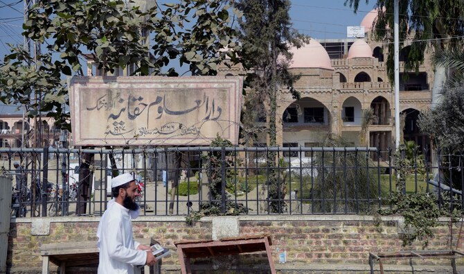 In this picture taken on October 19, 2020 an Islamic seminary student walks outside the Darul Uloom Haqqania seminary in Akora Khattak. (AFP/File)