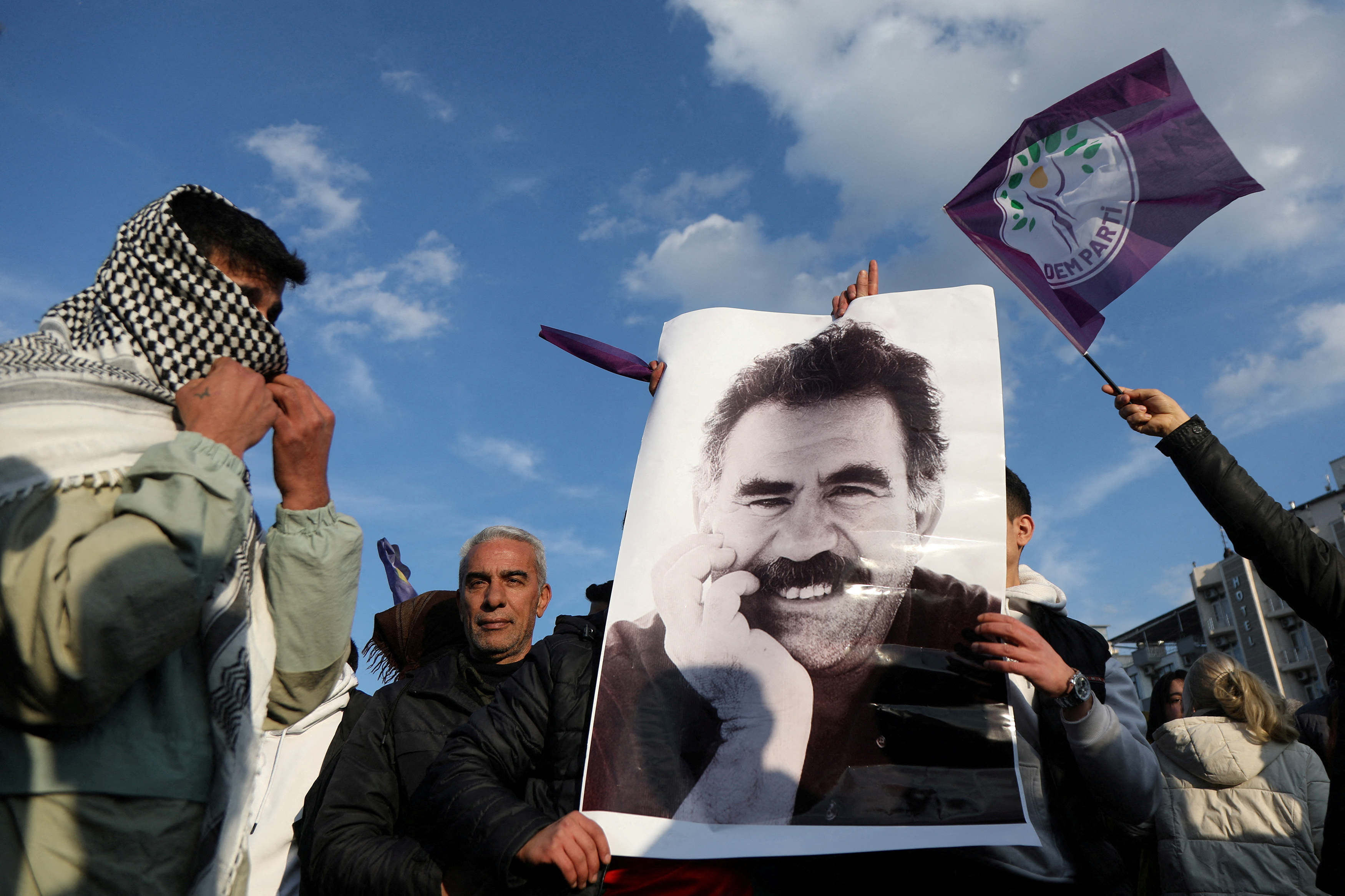 A demonstrator holds a picture of jailed Kurdish militant leader Abdullah Ocalan during a rally in Diyarbakir. (Reuters/File Photo)