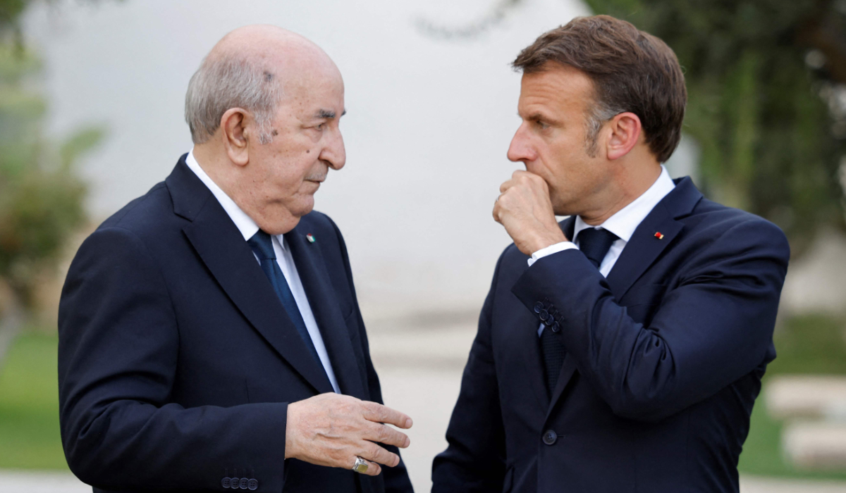 France's President Emmanuel Macron (R) talks with Algeria's President Abdelmadjid Tebboune (L) as they attend the G7 Summit hosted by Italy at the Borgo Egnazia resort in Savelletri on June 13, 2024. (AFP)