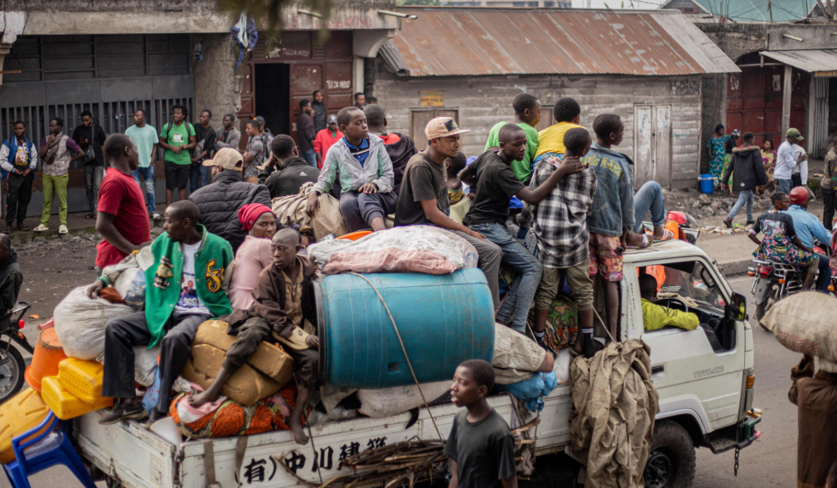 Residents carry their belongings on a truck as they flee from Kibati, where fighting has intensified, towards the city of Goma on January 26, 2025. (AFP)