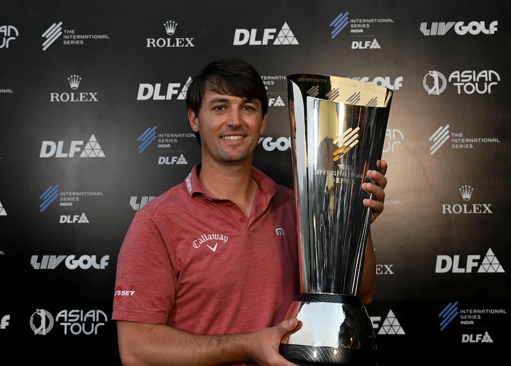 Ollie Schniederjans of the USA pictured with the winner’s trophy on Sunday claiming the International Series India at the DLF Golf and Country Club. (Paul Lakatos/Asian Tour)