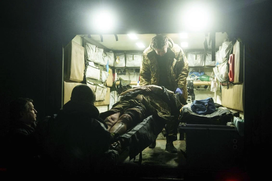 Ukrainian military medics of 59th brigade carry a wounded soldier on a stretcher from an ambulance arrived from the battlefield on Pokrovsk direction, Donetsk region in Ukraine on Jan. 29, 2025. (AP)