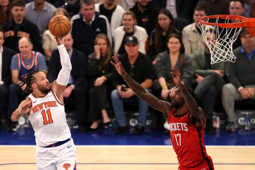 New York Knicks’ Jalen Brunson, left, shoots the ball past Houston Rockets’ Tari Eason during the second half of an NBA basketball game Monday in New York. (AP)