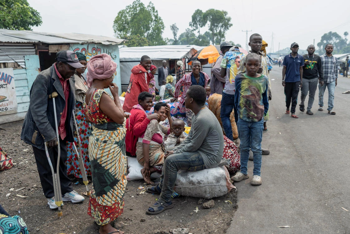 Displaced people wait along the road for transport back to their villages, days after the M23 rebel group seized the town of Goma, in North Kivu of Congo, on Feb. 3, 2025. (Reuters)