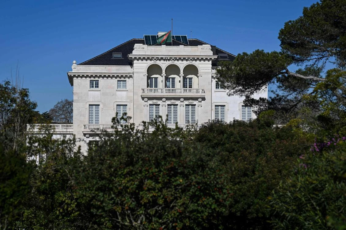 The Aga Khan Foundation headquarters in Lisbon on Feb. 5, 2025, with the flag at half mast, is pictured following the death of Prince Karim Al-Hussaini Aga Khan IV, Imam of the Ismaili Muslims in Lisbon. (AFP)