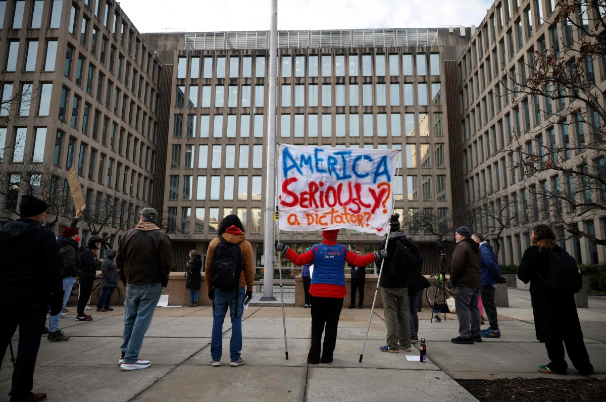 Protesters gather outside of the Theodore Roosevelt Federal Building headquarters of the US Office of Personnel Management on February 3, 2025 in Washington, DC. (Getty Images via AFP)