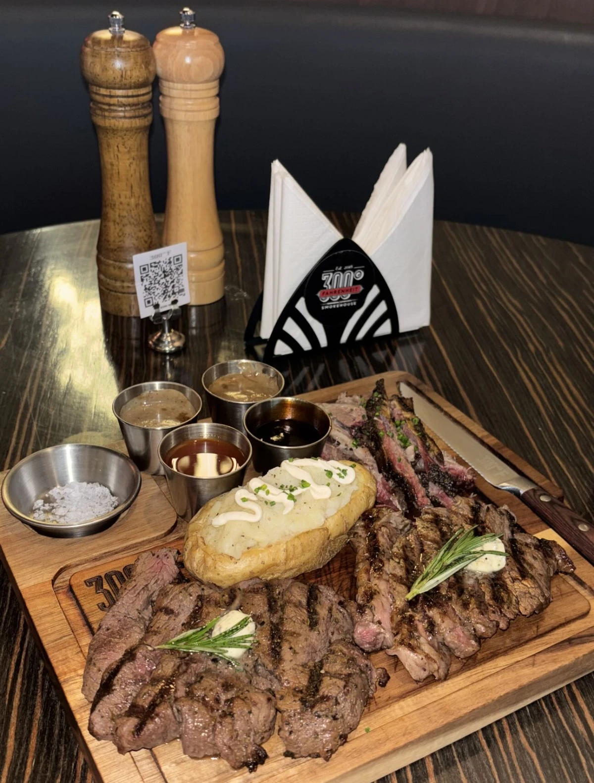 Perfectly grilled trio of ribeye, tenderloin, and short Ribs, served with a baked potato and a selection of rich sauces. (AN photo/Waad Hussain)