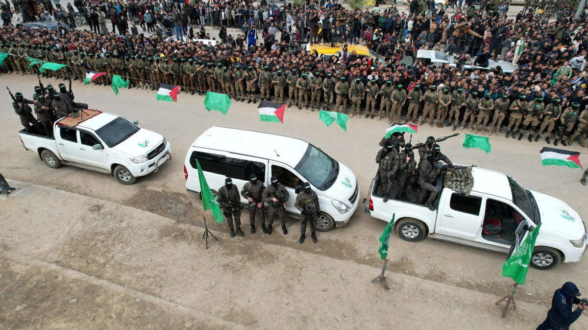 A drone view shows Palestinian Hamas militants parading on the day some hostages held in Gaza were released as part of a ceasefire and a hostages-prisoners swap deal in Deir Al-Balah in the central Gaza Strip. (File/Reuters)