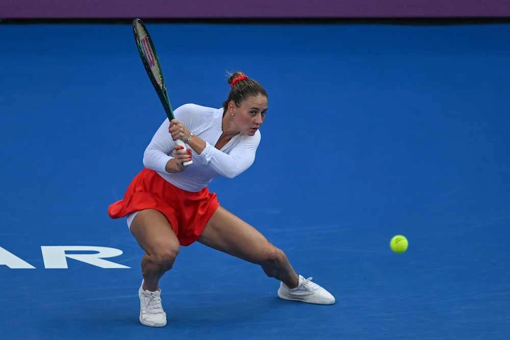 Marta Kostyuk of the Ukraine returns the ball to Coco Gauff of the US during their 2025 WTA Qatar Open match at the Khalifa International Tennis Complex in Doha on Tuesday. (AFP)