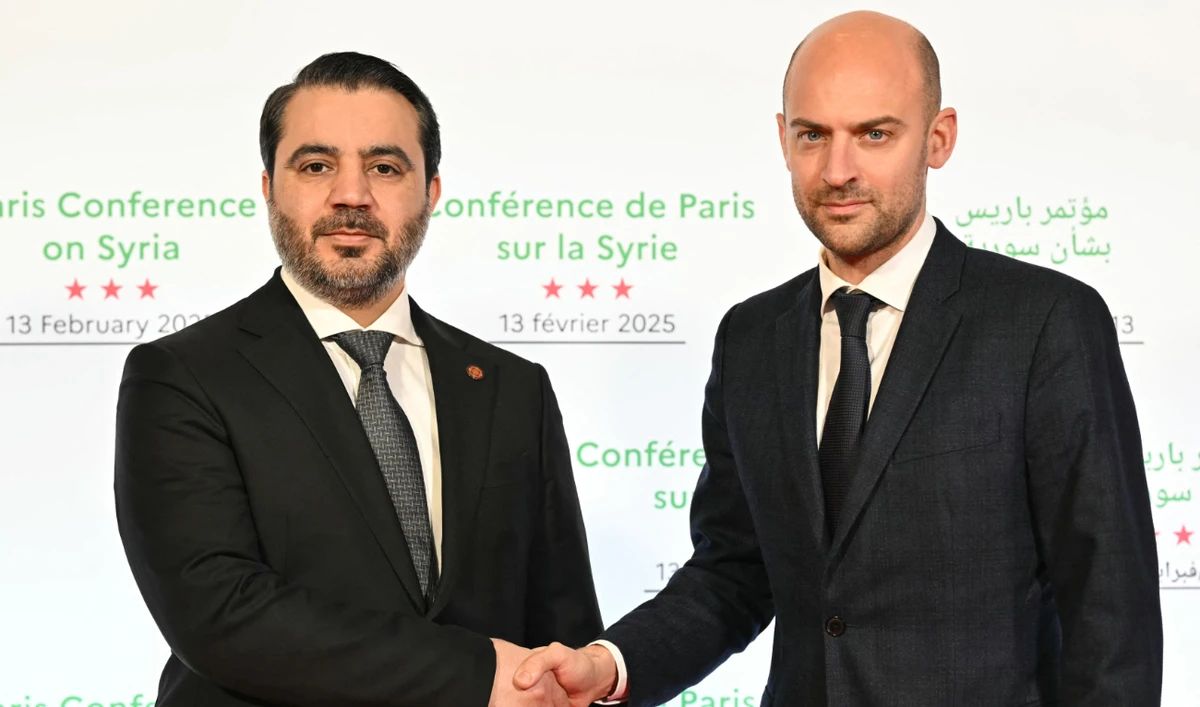 Syria’s Minister of Foreign Affairs Asaad Hassan Al-Shibani shakes hands with his French counterpart in Paris on Thursday. (AFP)