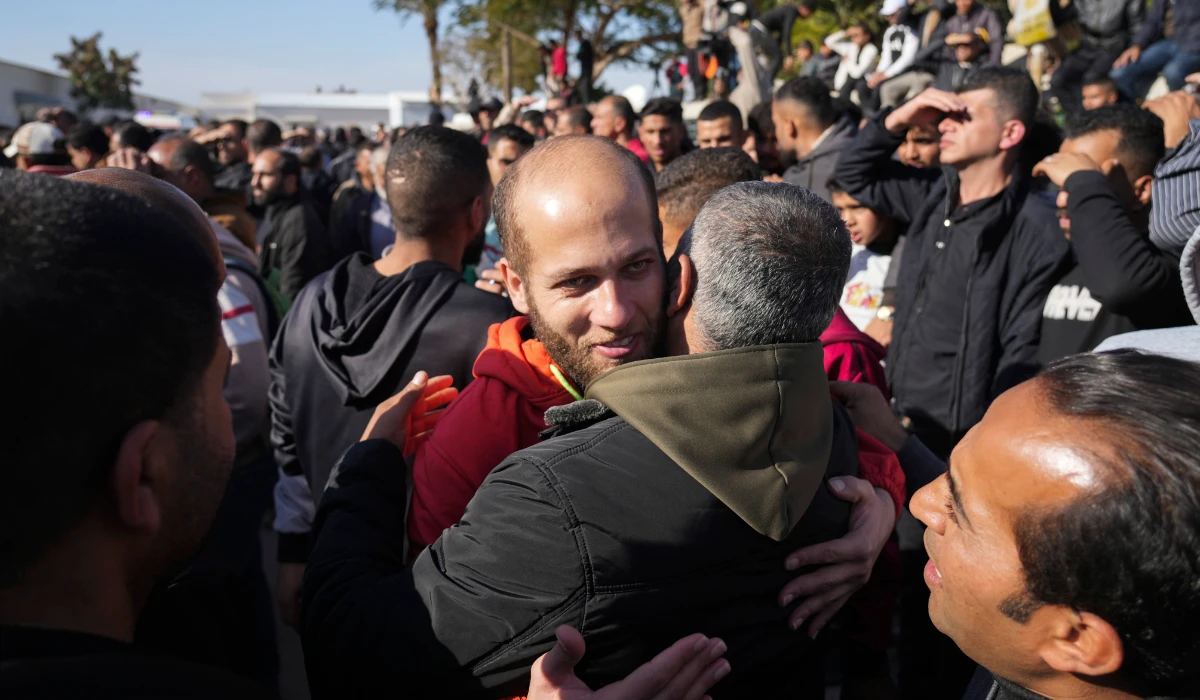 A freed Palestinian prisoner is greeted by relatives in Khan Younis, Gaza Strip, Saturday, Feb. 15, 2025, as he arrive in Gaza following his release from an Israeli prison as part of a ceasefire agreement between Hamas and Israel. (AP)