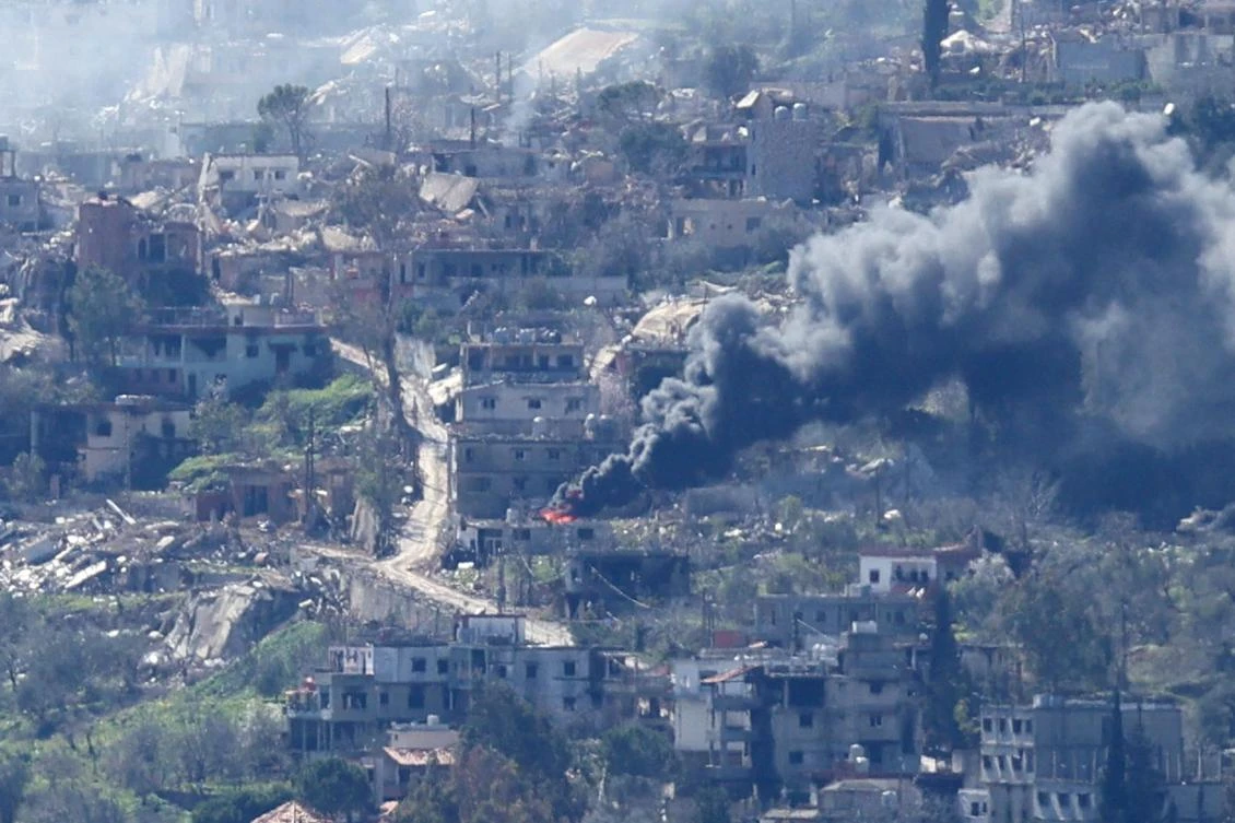 A photo taken from the southern Lebanese area of Marjayoun, shows smoke rising from buildings in the southern Lebanese village of Kfar Kila during an Israeli army operation in the village on February 15, 2025. (AFP)