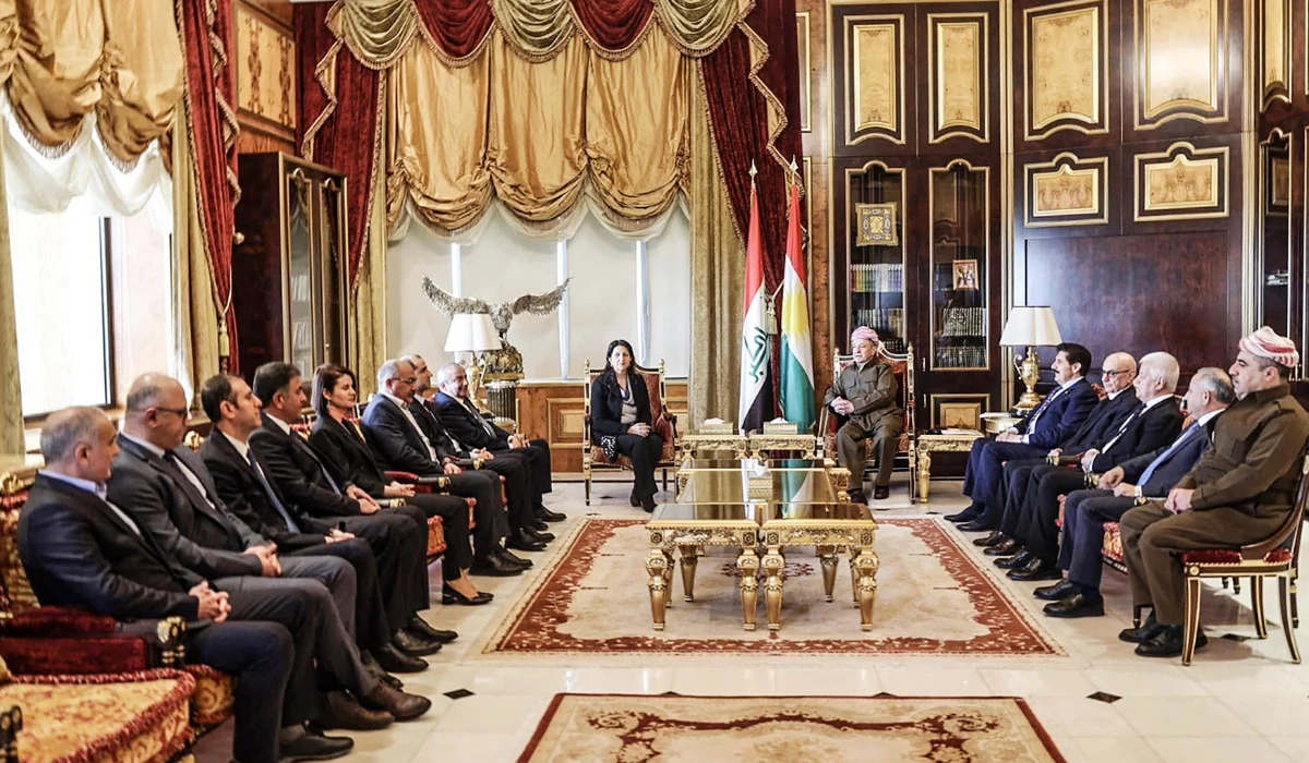 A handout picture provided by the office of the Kurdistan Democratic Party (KDP) leader on February 16, 2025, shows the KDP chief Masoud Barzani (centre-R) meeting with Co-leader of the People's Democratic Party (HDP) Pervin Buldan (centre-L), accompanied by members of an Imrali delegation in Barzaniís office in Arbil. (AFP)