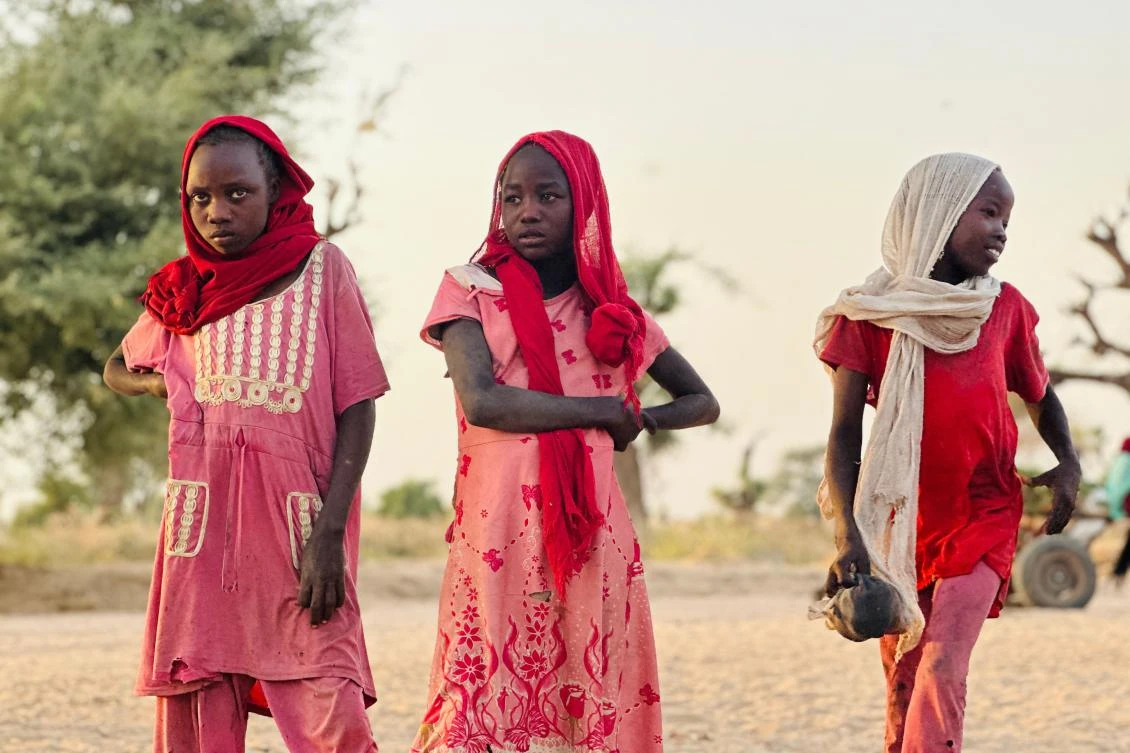 Displaced Sudanese girls, who fled the Zamzam camp, look on as they gather near the town of Tawila in North Darfur on Feb. 14, 2025. (AFP)