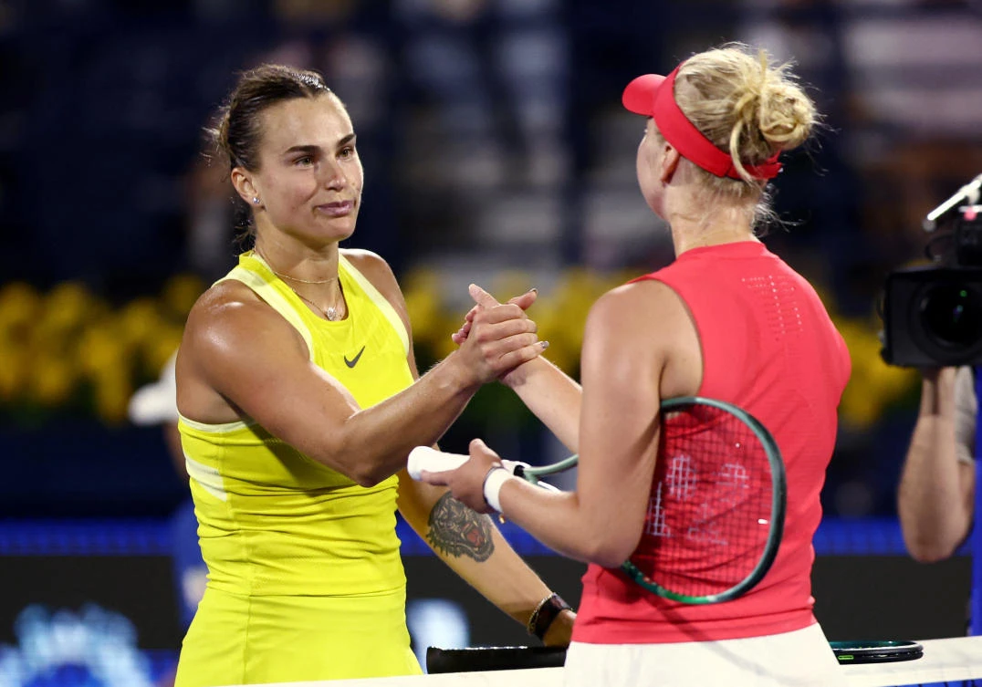 Belarus’ Aryna Sabalenka shakes hands with Denmark’s Clara Tauson after losing their round of 16 match at the Dubai Championships — Dubai Tennis Stadium, Dubai, Feb. 19, 2025. (Reuters)