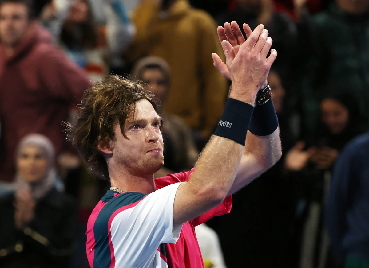 Russia's Andrey Rublev celebrates winning his semifinal against Canada's Felix Auger- Aliassime at the Qatar Open Friday. (Reuters)
