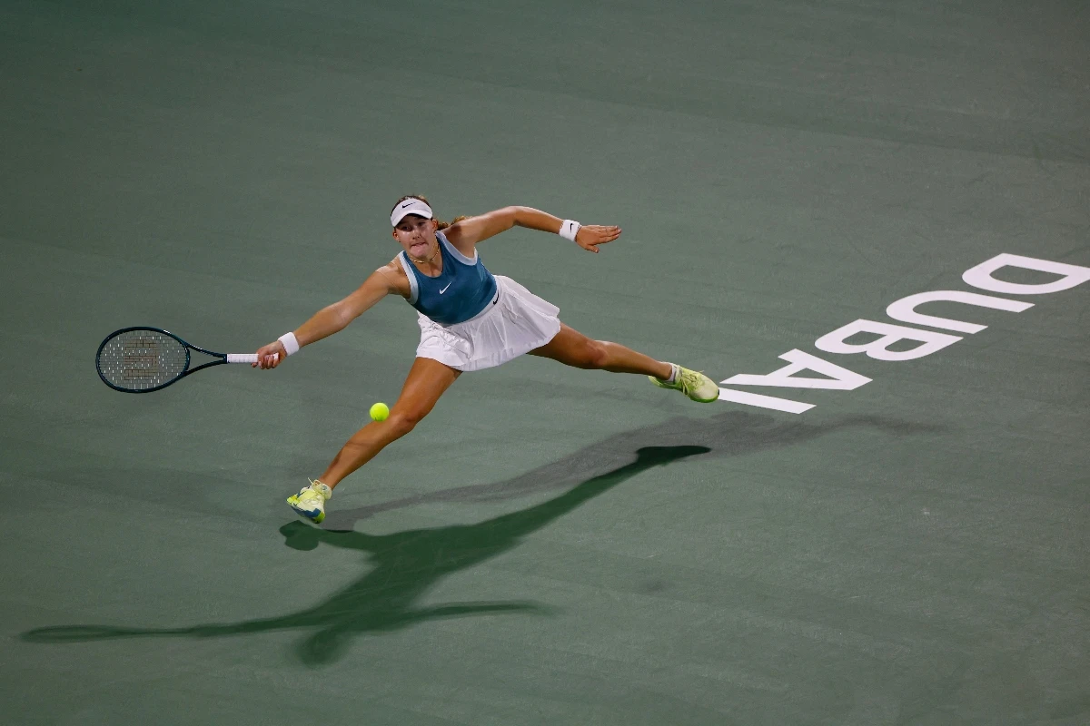 Russia's Mirra Andreeva in action during her semifinal match against Kazakhstan's Elena Rybakina at the Dubai Championships Friday. (Reuters)