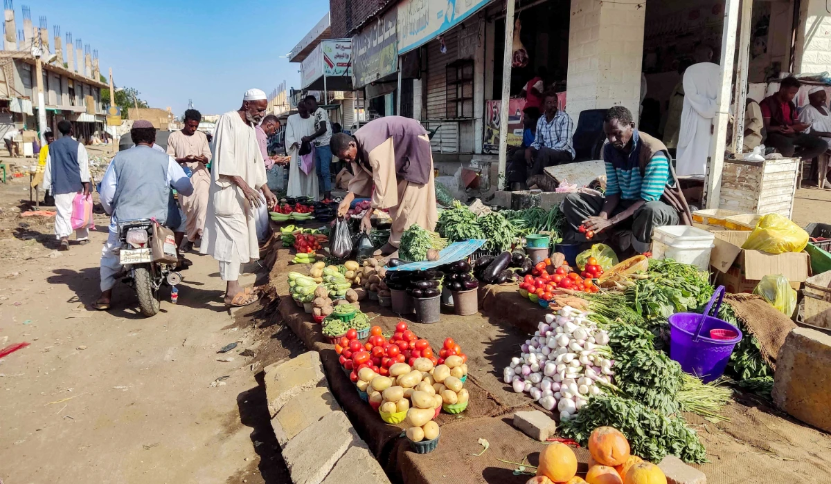 Street vendors sell their fruits and vegetables at a market in Wad Madani in Sudan’s Al-Jazira state after the army reclaimed the area from Rapid Support Forces. (AFP)