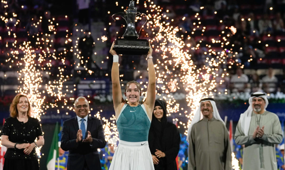 Russia’s Mirra Andreeva celebrates with the champion trophy after the Dubai Duty Free Tennis Championship final match in the UAE on Saturday. (AP)