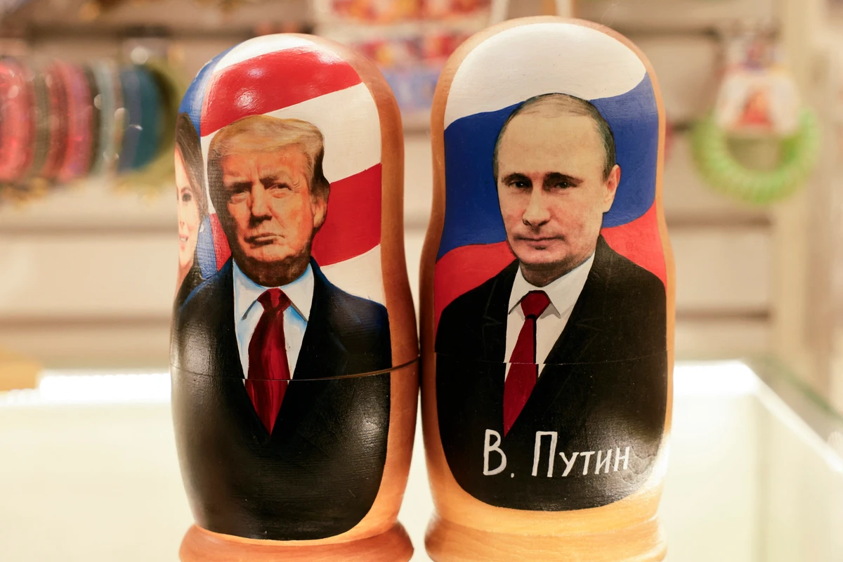 Traditional Russian wooden nesting dolls depicting Russia's President Vladimir Putin and US President Donald Trump are displayed at a gift shop in Moscow, Feb. 13, 2025. (AFP)