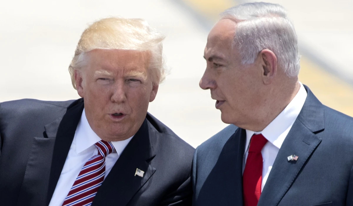 In this file photo taken on May 22, 2017, Israeli Prime Minister Benjamin Netanyahu (R) and US President Donald Trump speak upon the latter's arrival at Ben Gurion International Airport in Tel Aviv. (AFP)