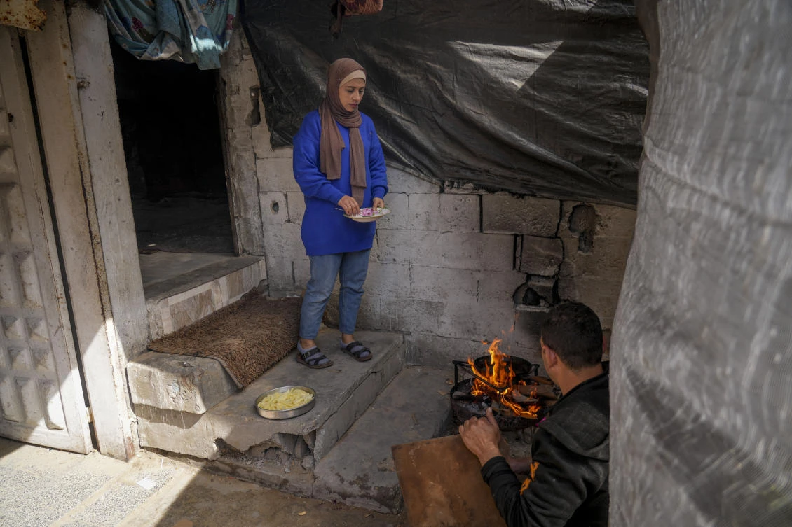 Rawya Tamboura and her family, left, are among nearly 600,000 Palestinians who flooded back into northern Gaza after a ceasefire was implemented. (AP)