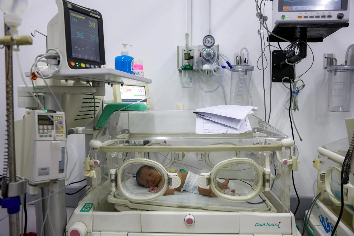 A prematurely-born infant lies in an incubator at the neonatal intensive care unit NICU at a hospital in Gaza City on February 25, 2025. (AFP)
