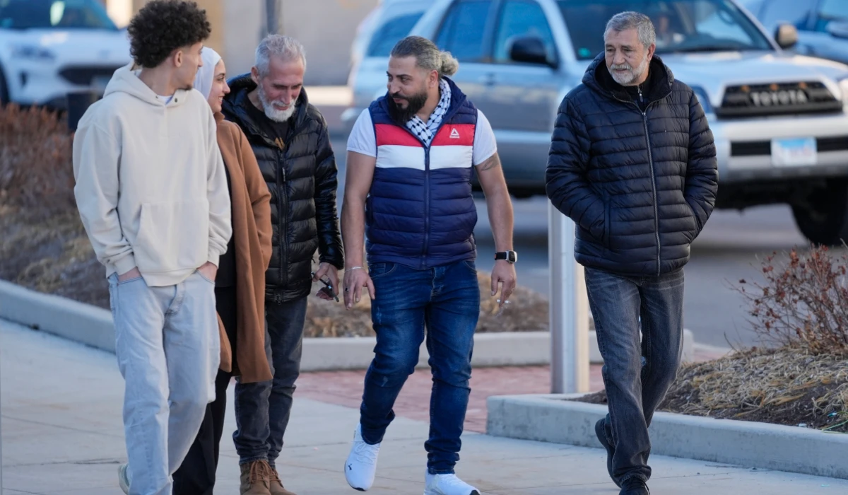 Odai Alfayoumi, second from right, father of six-year-old Palestinian boy Wadee Alfayoumi, leaves Will County Courthouse with others where Joseph Czuba, 73, is charged with and on trial in the fatal stabbing of the boy and the wounding of his mother Hanan Shaheen, Tuesday, Feb. 25, 2025, in Joliet, Ill. (AP)