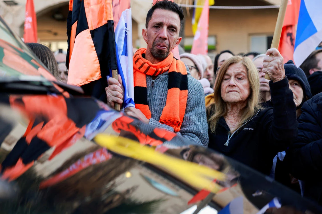 Israelis react during a funeral procession for Shiri, 32, and her two children Kfir, 9 months old, and Ariel, 4, of the Bibas family, who were kidnapped from their home in Kibbutz Nir Oz during the deadly October 7, 2023 attack by Hamas and then killed in Gaza, in Rishon Le'Zion, Israel February 26, 2025. (Reuters)