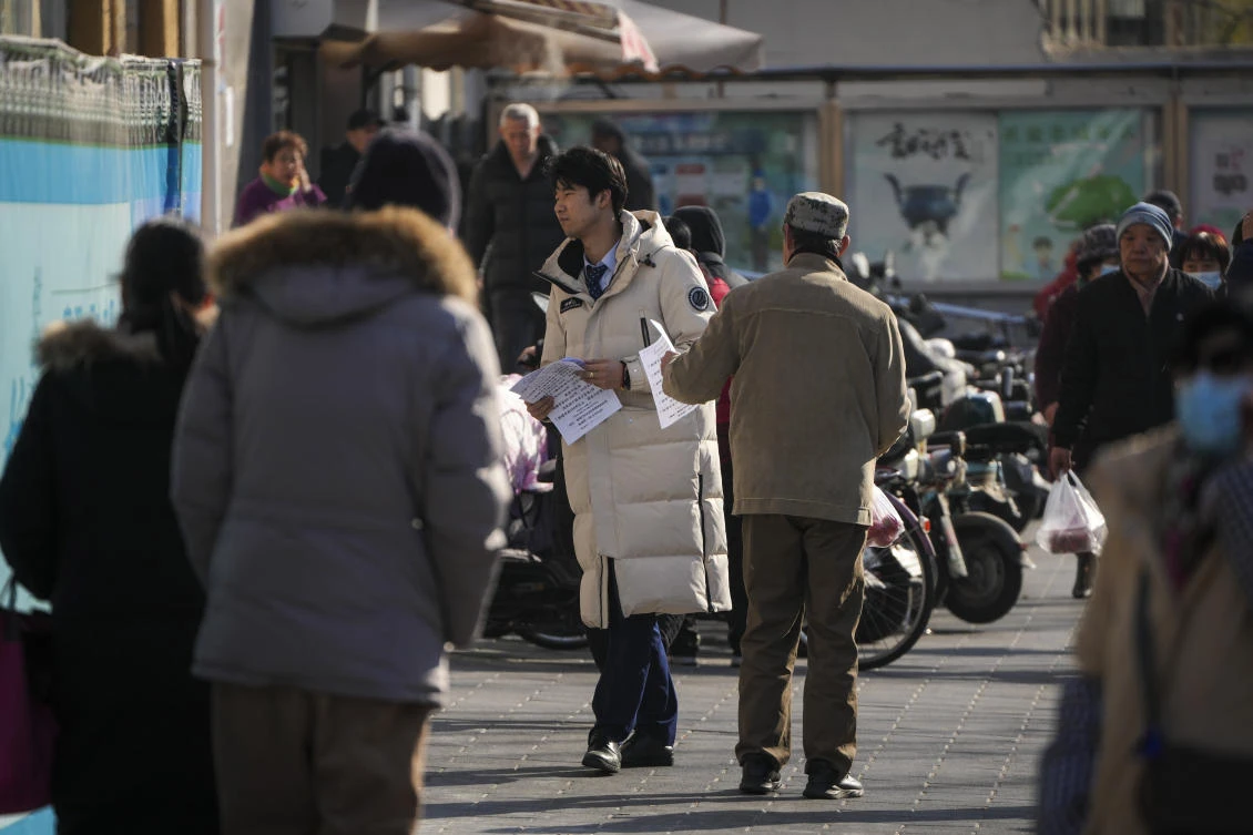 General photo of Chinese residents near a supermarket in Beijing, Wednesday, Feb. 26, 2025. (AP)