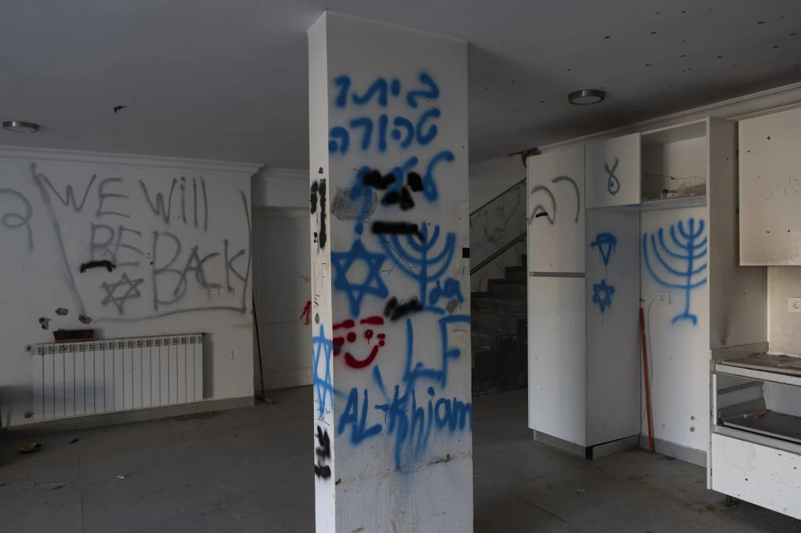 Hebrew and English graffiti written by Israeli soldiers during the ground offensive against Hezbollah, is seen in a house in the southern town of Khiam, Lebanon, Feb. 18, 2025. (AP)
