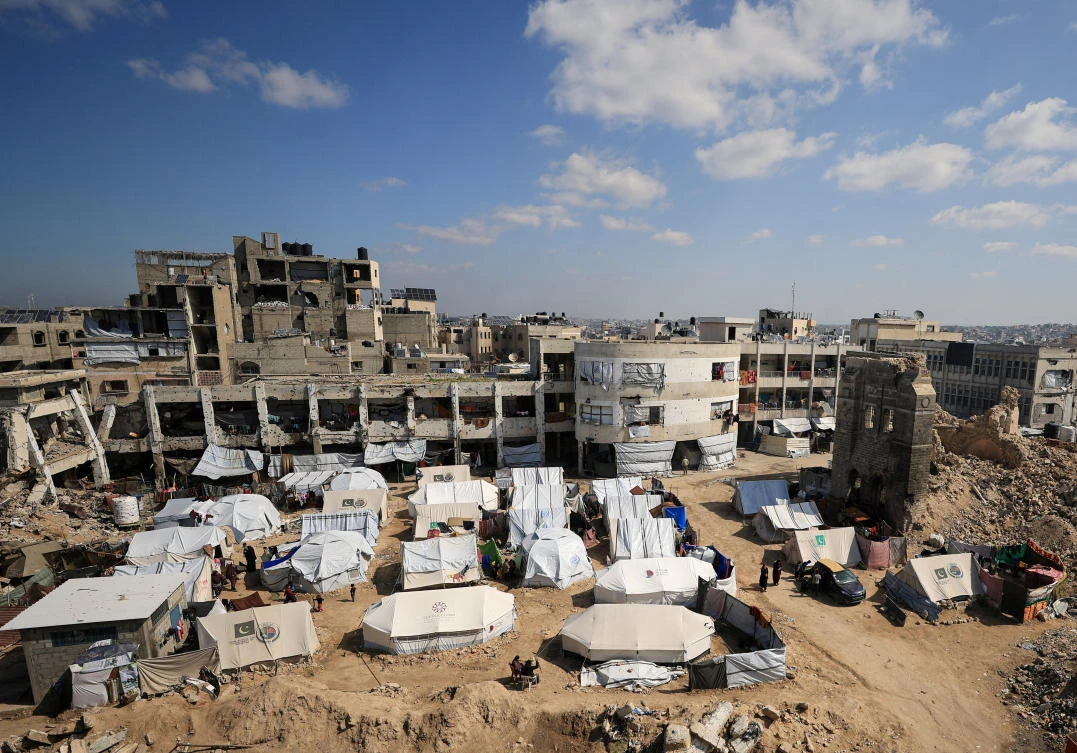 Palestinians sheltering in tents set up near the rubble of buildings in Gaza City, February 26, 2025. (Reuters)