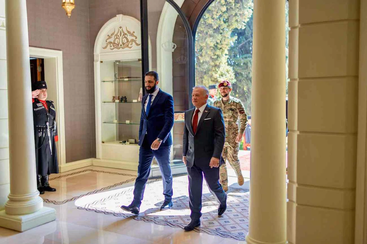 King Abdullah II (R) and Crown Prince Hussein (back) accompany visiting Syrian President Ahmed Al-Sharaa, in Amman, on February 26, 2025. (AFP)